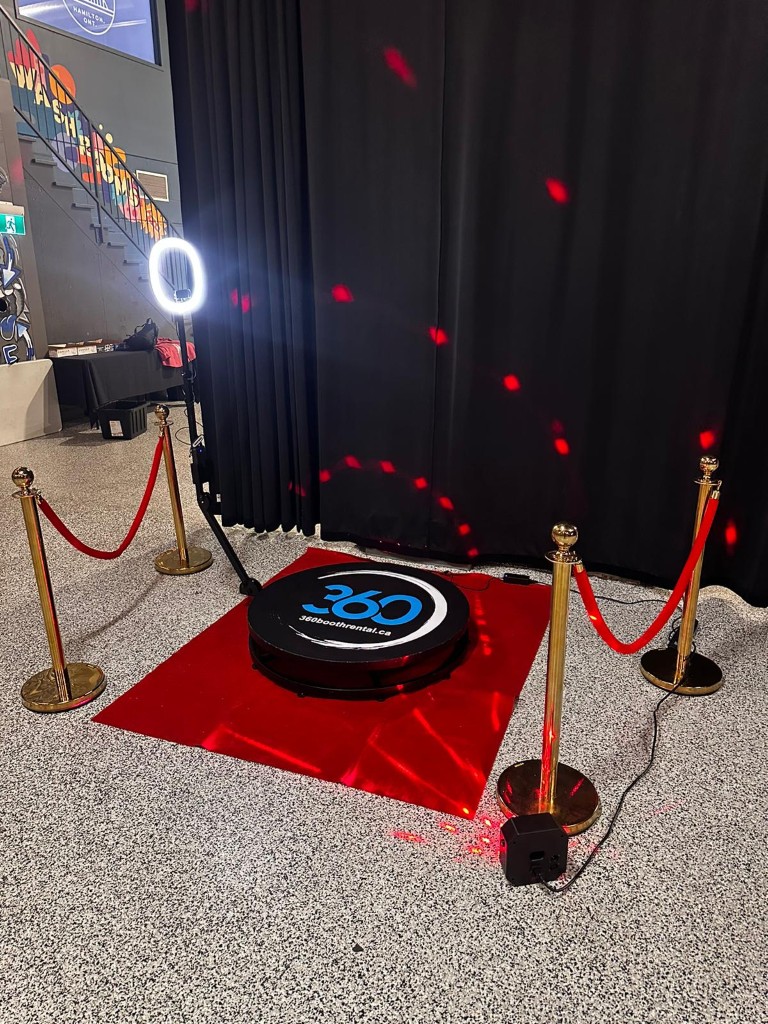 360 video booth with stanchions and a red carpet in Ajax