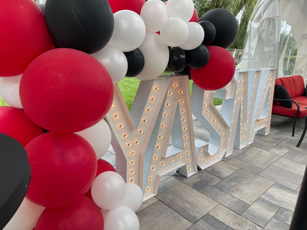 Balloons framing marquee letters in Brampton