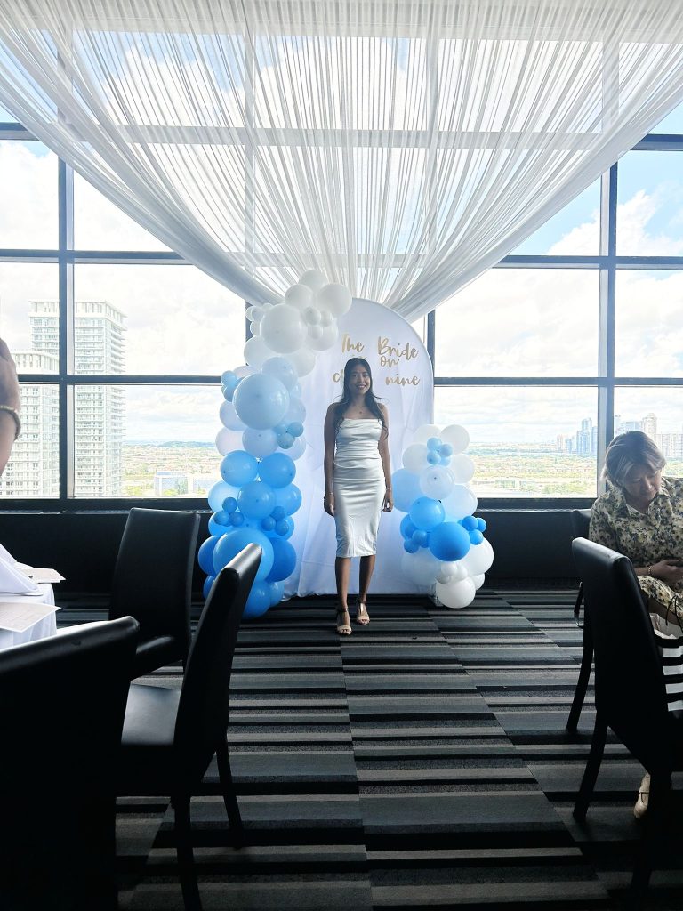 Balloon decor framing a bridal backdrop in Newmarket