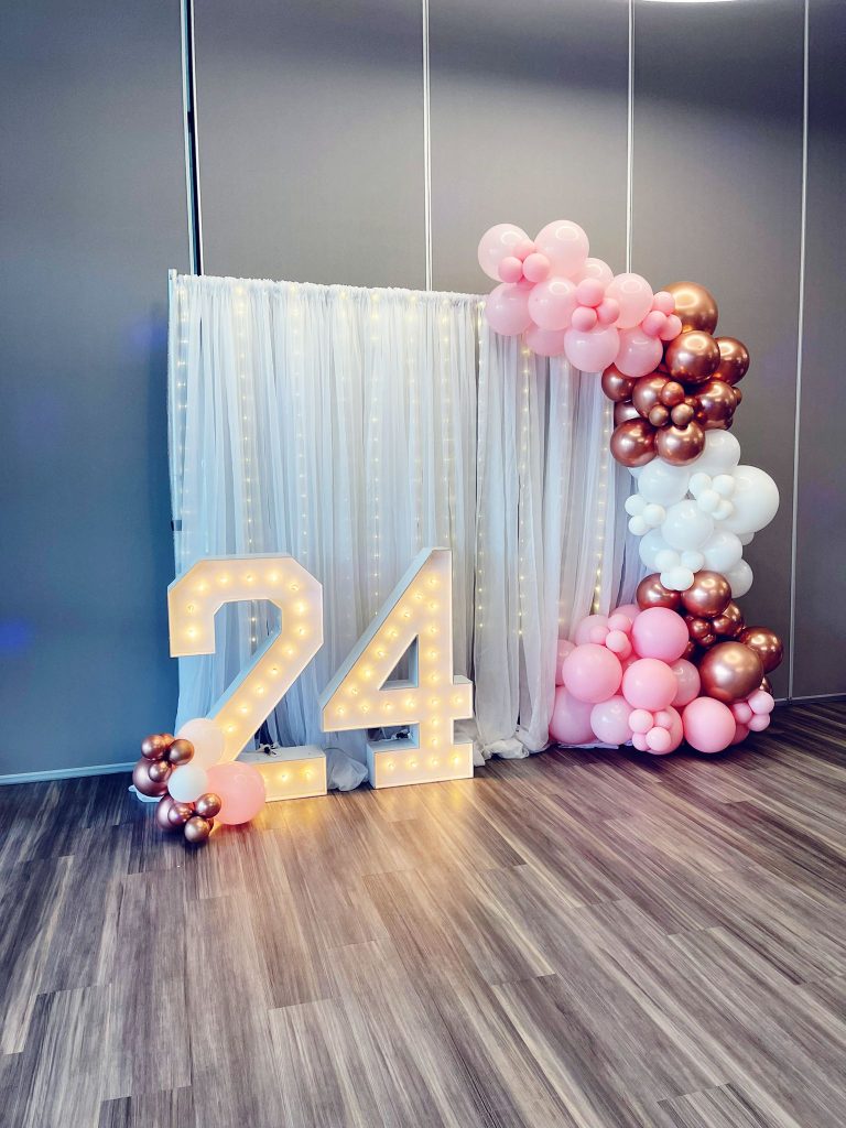 Marquee rental in Newmarket including white drapes and balloon garlands