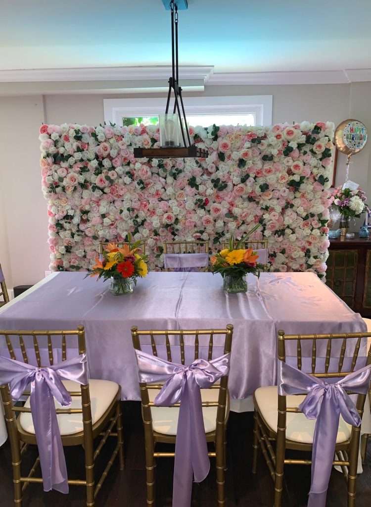Richmond Hill flower wall with table setting and chairs